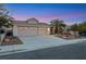 House exterior view, three car garage, desert landscaping at 517 Annet St, Henderson, NV 89052