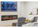 Living room featuring a modern fireplace and city skyline view at 517 Annet St, Henderson, NV 89052