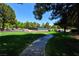 Well-maintained tennis courts nestled in a lush, green community landscape at 5508 Big Sky, Las Vegas, NV 89149