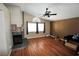 Bright living room featuring hardwood floors, a fireplace, and vaulted ceilings at 5508 Big Sky, Las Vegas, NV 89149