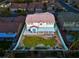 Aerial view of the home with a manicured lawn and covered patio within a fenced yard at 553 Sinfold Park St, Las Vegas, NV 89148