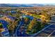 Aerial view of community, showing homes and green spaces at 553 Sinfold Park St, Las Vegas, NV 89148