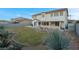 Backyard with grassy area, covered patio, and storage shed at 553 Sinfold Park St, Las Vegas, NV 89148