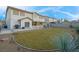 Expansive backyard features a covered patio and well-maintained landscaping at 553 Sinfold Park St, Las Vegas, NV 89148