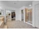 The bathroom features a glass shower and vanity space, a closet, offering functionality and style at 553 Sinfold Park St, Las Vegas, NV 89148