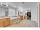 This bathroom has dual sinks and a large tub surrounded by a unique block window for natural light at 553 Sinfold Park St, Las Vegas, NV 89148