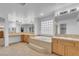 Spa-like bathroom with double vanity, a large soaking tub, and ample lighting at 553 Sinfold Park St, Las Vegas, NV 89148