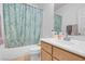 Bathroom featuring tile flooring, vanity, and shower with a stylish patterned shower curtain at 553 Sinfold Park St, Las Vegas, NV 89148