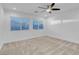 Spacious bedroom featuring neutral carpet and a modern ceiling fan at 553 Sinfold Park St, Las Vegas, NV 89148