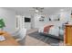 This bedroom features an ensuite bathroom, and a view from the chair of a desk, bed and interior design at 553 Sinfold Park St, Las Vegas, NV 89148