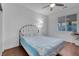 Bedroom with wood floor, natural light from the window and stylish contemporary furniture at 553 Sinfold Park St, Las Vegas, NV 89148