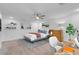 This bright bedroom features a stylish desk, a cozy bed with modern decor, and soothing natural light at 553 Sinfold Park St, Las Vegas, NV 89148