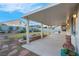 Spacious covered patio extends from the home to the backyard at 553 Sinfold Park St, Las Vegas, NV 89148