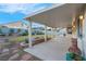 Inviting covered patio with ample space for lounging and outdoor dining at 553 Sinfold Park St, Las Vegas, NV 89148