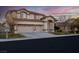 Charming two-story home featuring a three-car garage and well-maintained landscaping at 553 Sinfold Park St, Las Vegas, NV 89148