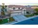 Well-maintained two-story home with a three-car garage and lovely landscaping, situated in a peaceful neighborhood at 553 Sinfold Park St, Las Vegas, NV 89148