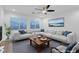 Bright living room with ceiling fan, throw pillows and large window providing natural light at 553 Sinfold Park St, Las Vegas, NV 89148