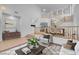 Open living room with high ceilings and staircase with beautiful wood banister at 553 Sinfold Park St, Las Vegas, NV 89148