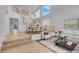 Bright living room with high ceilings and staircase with beautiful wood banister at 553 Sinfold Park St, Las Vegas, NV 89148