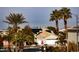 Aerial view of house with solar panels and palm trees at 575 Dusty Palms Ln, Henderson, NV 89052