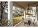 Covered patio with seating area, ceiling fan, and fire pit at 575 Dusty Palms Ln, Henderson, NV 89052