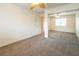 Light bedroom boasting a sliding closet door and overhead ceiling fan at 575 Dusty Palms Ln, Henderson, NV 89052