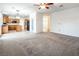 Living room with kitchen access and ceiling fan at 575 Dusty Palms Ln, Henderson, NV 89052