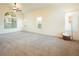 Spacious living room with carpet flooring and large windows at 575 Dusty Palms Ln, Henderson, NV 89052