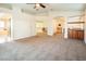 Expansive main bedroom with carpet, ensuite bathroom, and wet bar area at 575 Dusty Palms Ln, Henderson, NV 89052