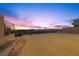 Empty lot with distant city views and sunset at 577 Overlook Rim Dr, Henderson, NV 89012