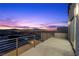 Balcony with city views and sunset at 577 Overlook Rim Dr, Henderson, NV 89012