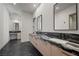 Spa-like bathroom with double vanity and marble counters at 577 Overlook Rim Dr, Henderson, NV 89012