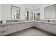 Elegant bathroom with a double vanity and large mirrors at 577 Overlook Rim Dr, Henderson, NV 89012