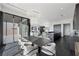 Open dining area with modern table and kitchen access at 577 Overlook Rim Dr, Henderson, NV 89012