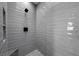 Spa-like shower with gray tile and built-in shelving at 577 Overlook Rim Dr, Henderson, NV 89012