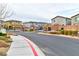 Gated entrance to a community with well-maintained landscaping at 6046 Castle Gardens Ave, Las Vegas, NV 89130