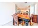 Bright dining area with wood table and chairs, offering views into the kitchen at 6046 Castle Gardens Ave, Las Vegas, NV 89130