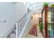 Staircase with chair lift, hardwood floors, and view into living room at 6046 Castle Gardens Ave, Las Vegas, NV 89130