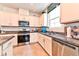 Bright kitchen with white cabinets and granite countertops at 6046 Castle Gardens Ave, Las Vegas, NV 89130