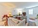 Spacious living room with gray sofas, a coffee table, and a large TV at 6046 Castle Gardens Ave, Las Vegas, NV 89130