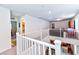 Upstairs hallway with white railing and views of the home's interior at 6046 Castle Gardens Ave, Las Vegas, NV 89130