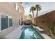 Long, narrow backyard with pool and patio furniture at 6050 Belvedere Canyon Ave, Las Vegas, NV 89139