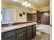 Bathroom with dark brown vanity, shower, and bathtub at 6050 Belvedere Canyon Ave, Las Vegas, NV 89139