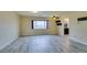 Spacious bedroom with wood-look floors and large window at 6050 Belvedere Canyon Ave, Las Vegas, NV 89139