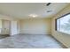 Light and airy bedroom with wood-look floors and window at 6050 Belvedere Canyon Ave, Las Vegas, NV 89139