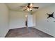 Bedroom with ceiling fan, carpet, and en-suite bathroom at 6050 Belvedere Canyon Ave, Las Vegas, NV 89139