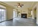 Living room with hardwood floors, fireplace, and balcony access at 6050 Belvedere Canyon Ave, Las Vegas, NV 89139