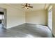 Living room with hardwood floors and access to kitchen at 6050 Belvedere Canyon Ave, Las Vegas, NV 89139