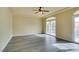 Living room with hardwood floors, access to balcony at 6050 Belvedere Canyon Ave, Las Vegas, NV 89139