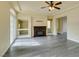 Spacious living room featuring a fireplace and wood-look floors at 6050 Belvedere Canyon Ave, Las Vegas, NV 89139